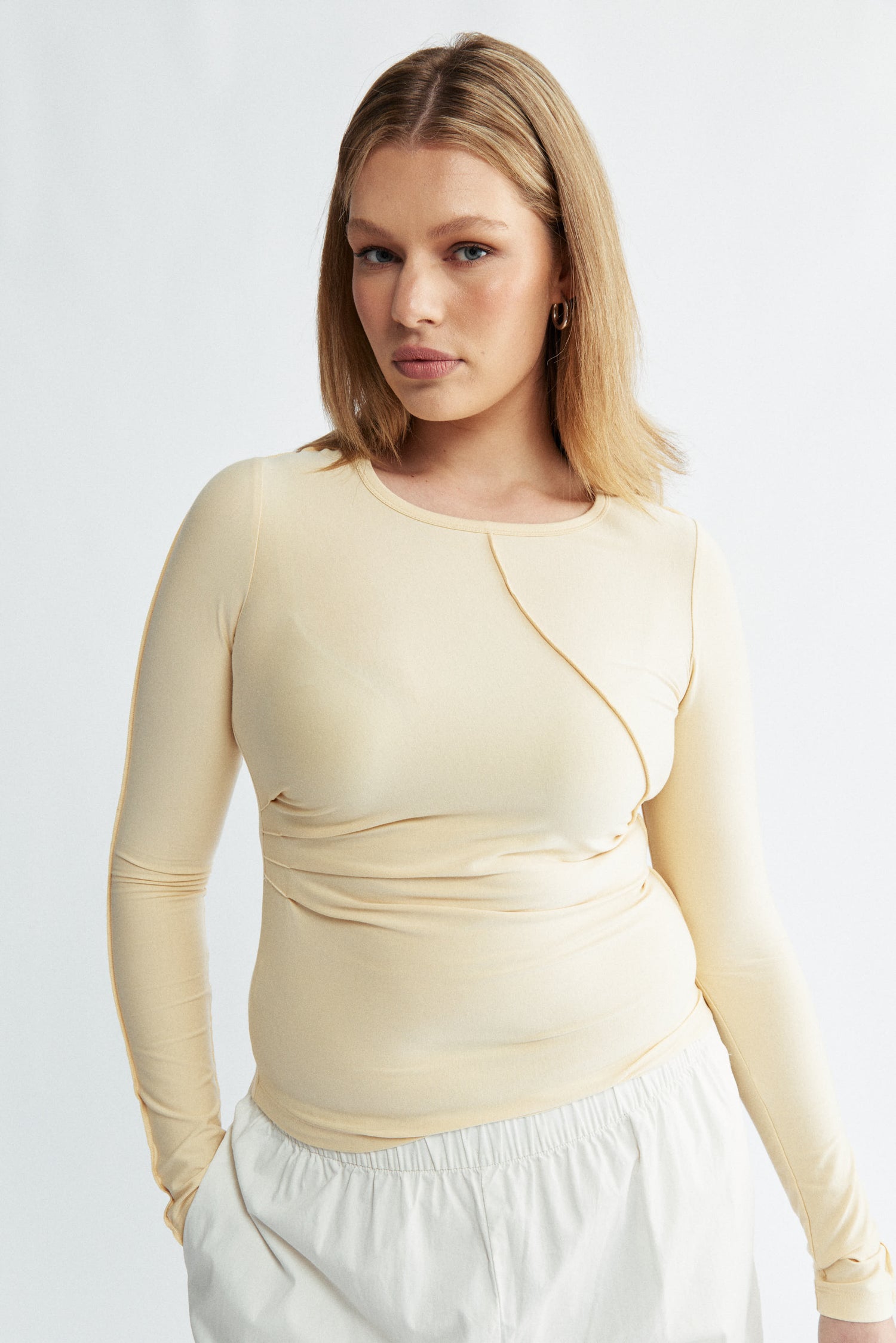 Womens yellow long sleeve seam detail top